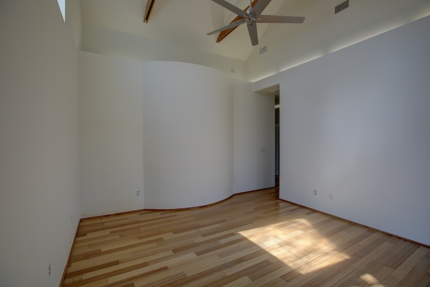 1607 South Elm Street Georgetown, TX 78626 - Photo 28 of 40 a view of empty room with wooden floor and fan