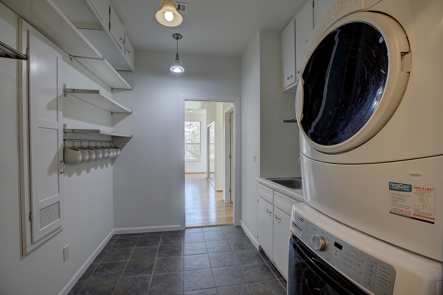 1607 South Elm Street Georgetown, TX 78626 - Photo 29 of 40 a kitchen with a refrigerator and cabinets