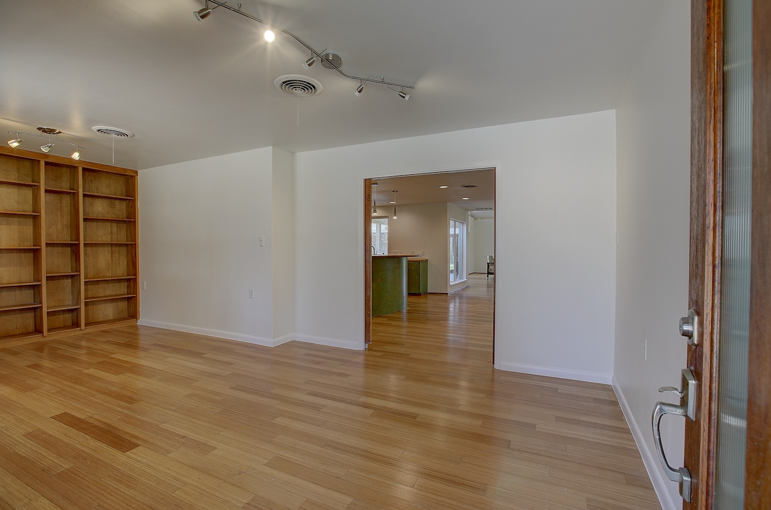 1607 South Elm Street Georgetown, TX 78626 - Photo 3 of 40 a view of empty room with wooden floor and closet