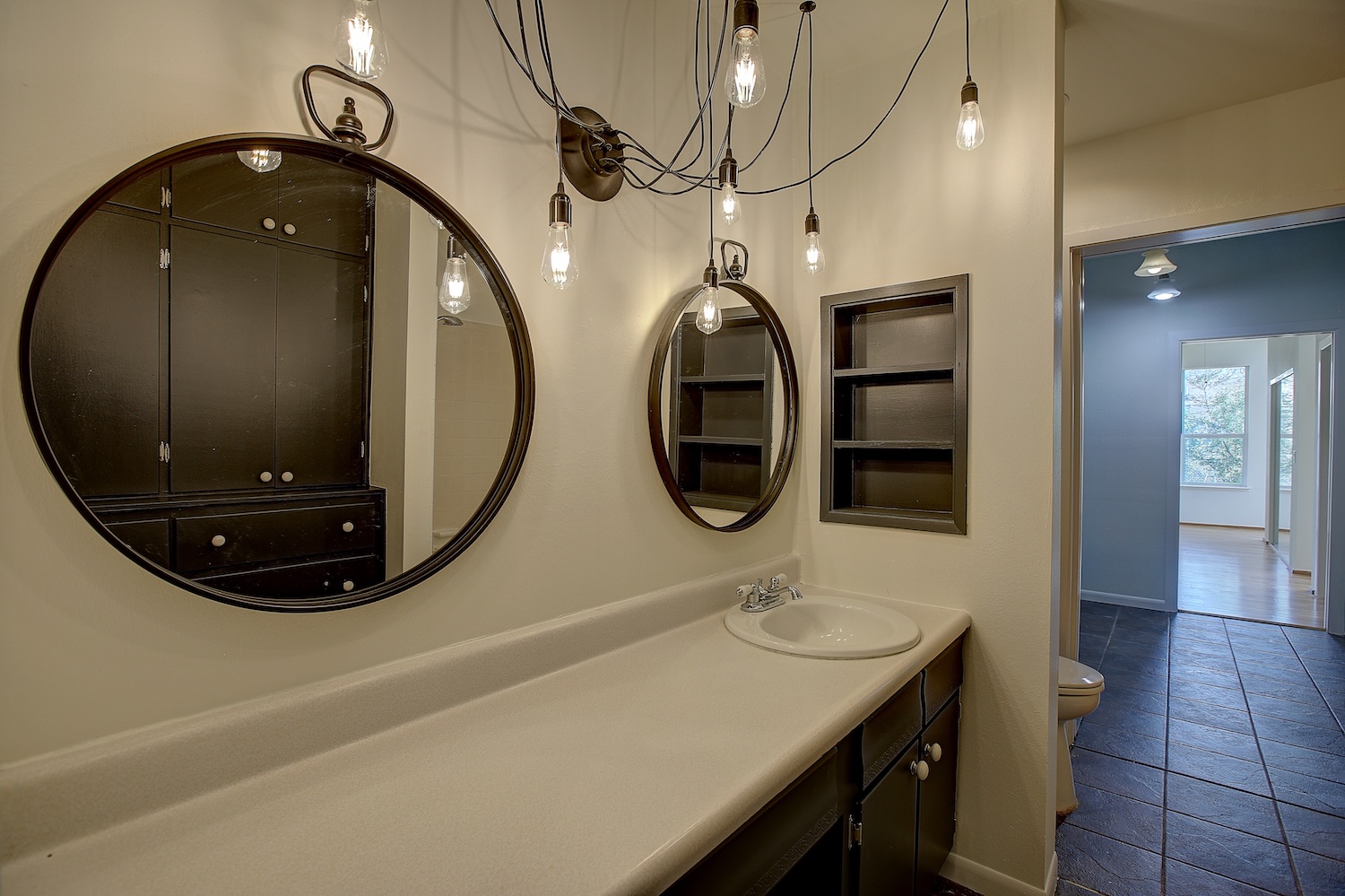 1607 South Elm Street Georgetown, TX 78626 - Photo 31 of 40 a bathroom with a sink and mirror