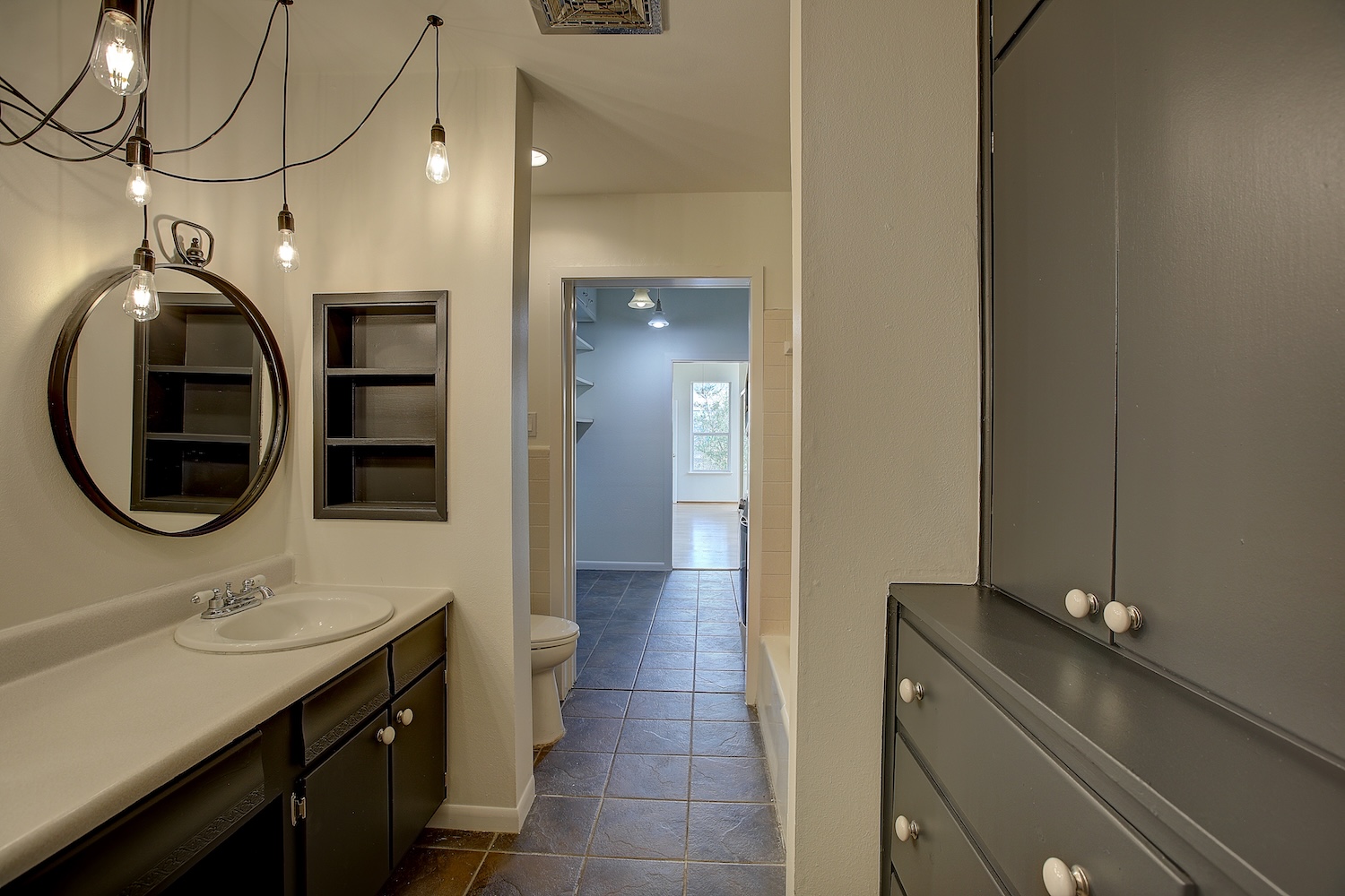 1607 South Elm Street Georgetown, TX 78626 - Photo 32 of 40 a bathroom with a sink and a mirror