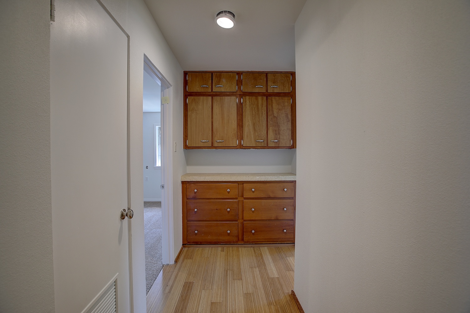 1607 South Elm Street Georgetown, TX 78626 - Photo 33 of 40 a view of walk in closet with wooden floor