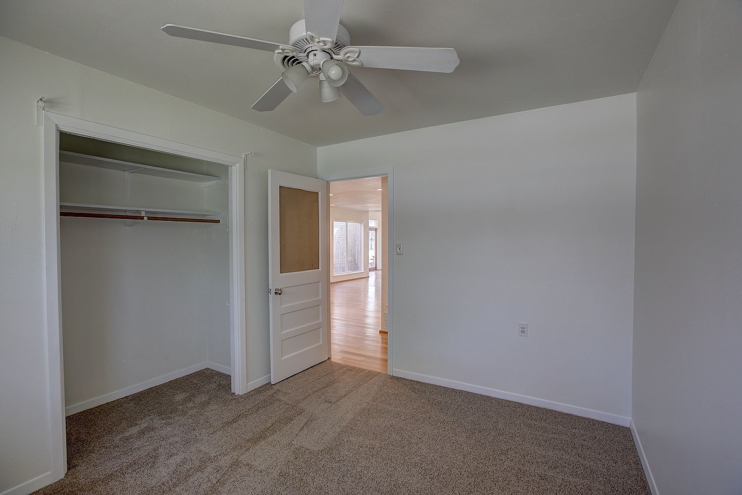 1607 South Elm Street Georgetown, TX 78626 - Photo 36 of 40 an empty room with closet and a ceiling fan