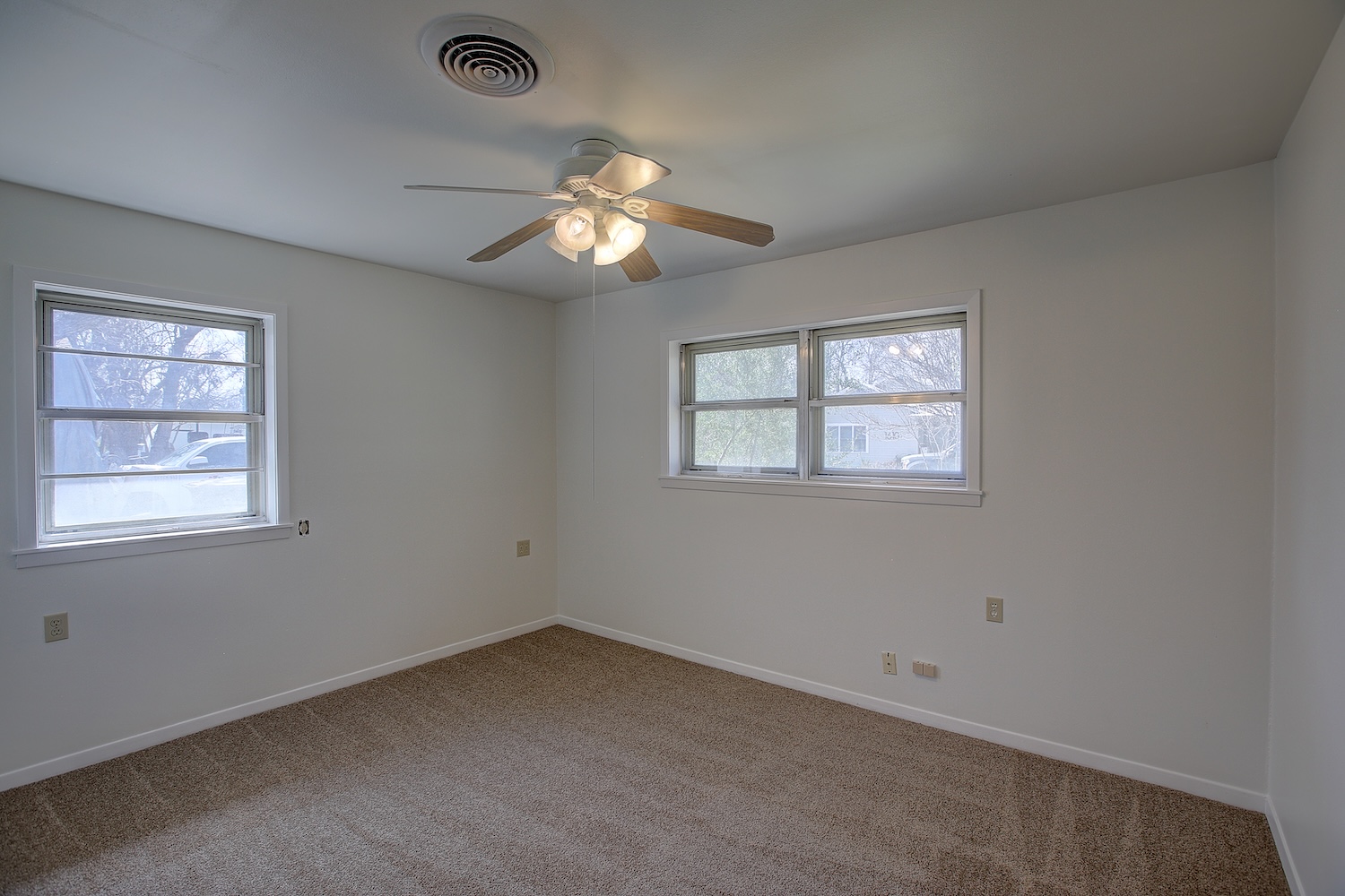 1607 South Elm Street Georgetown, TX 78626 - Photo 37 of 40 an empty room with windows and fan