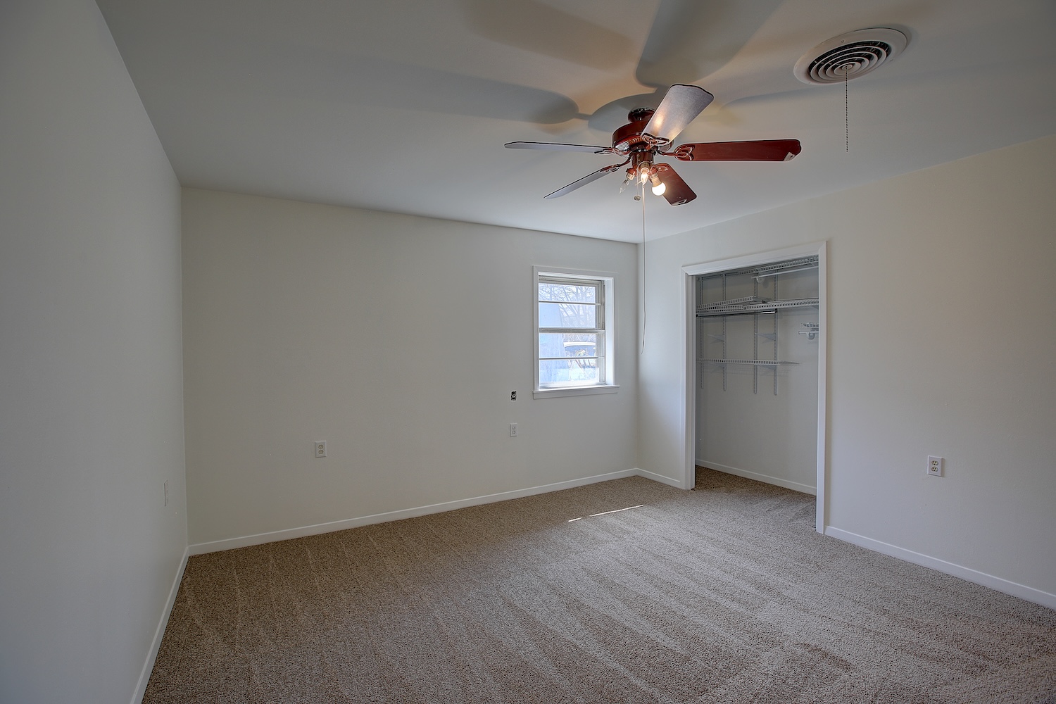 1607 South Elm Street Georgetown, TX 78626 - Photo 40 of 40 an empty room with windows and fan