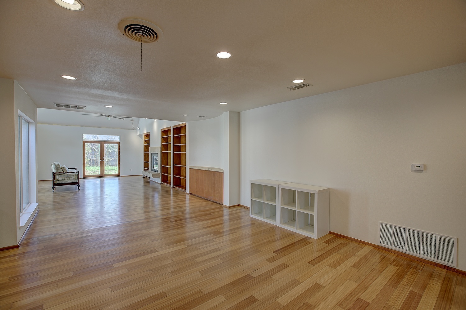 1607 South Elm Street Georgetown, TX 78626 - Photo 5 of 40 a view of empty room with wooden floor