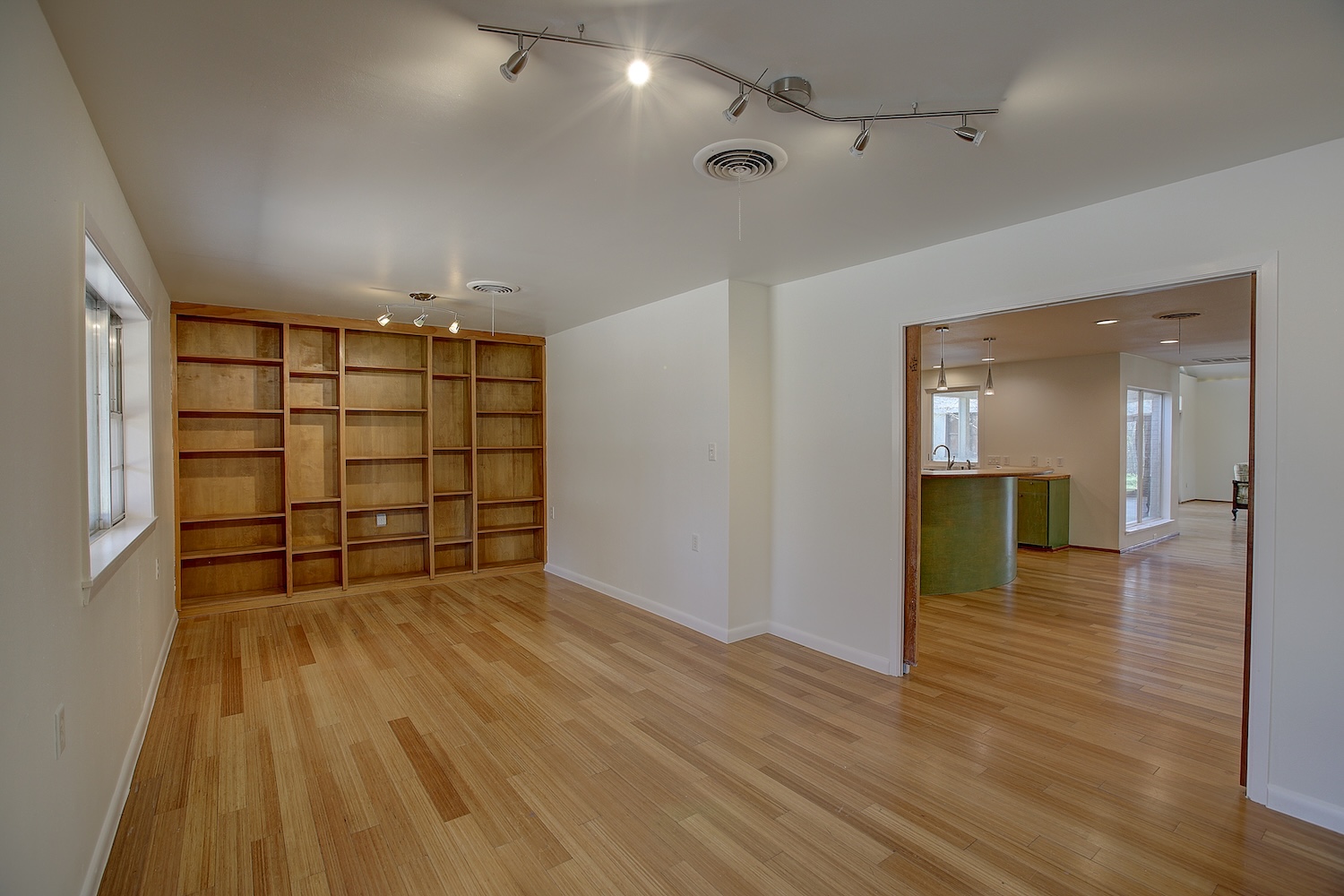 1607 South Elm Street Georgetown, TX 78626 - Photo 10 of 40 wooden floor in an empty room with a window
