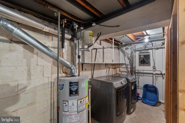 a view of a backyard with plants and a patio