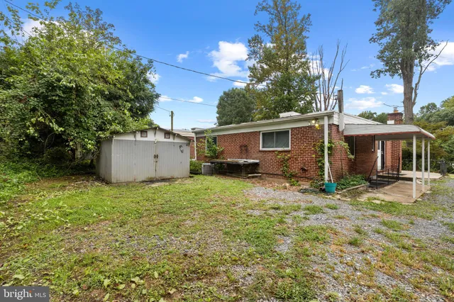 a backyard of a house with a yard and trees