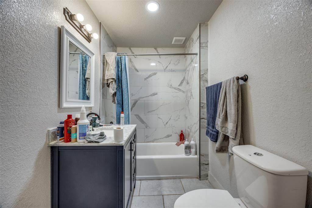 725 South Walnut Street Sherman, TX 75090 - Photo 7 of 10 a bathroom with a sink toilet and shower