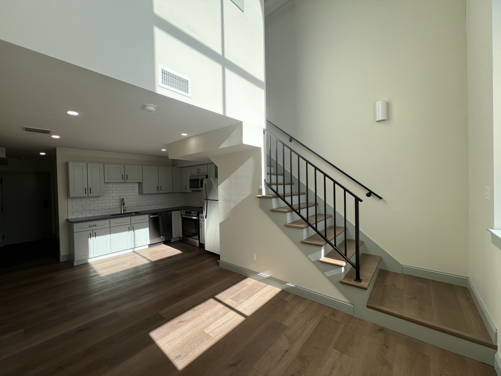 160 Seabury Street, Unit 32 Fall River, MA 02720 - Photo 5 of 13 a view of entryway and hall with wooden floor