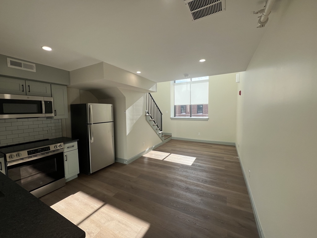 160 Seabury Street, Unit 32 Fall River, MA 02720 - Photo 5 of 14 a view of a kitchen with a sink and an oven