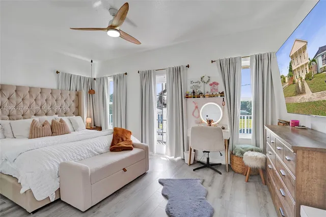 a living room with furniture flowerpot and window