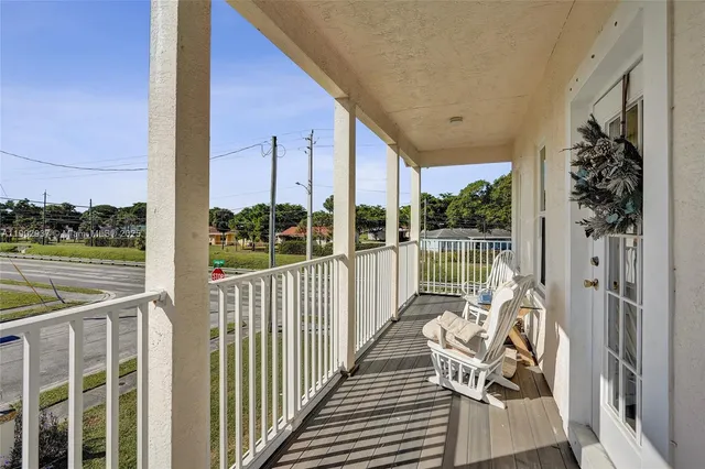 a view of balcony with furniture