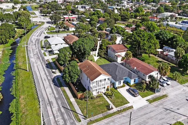 an aerial view of residential houses with outdoor space