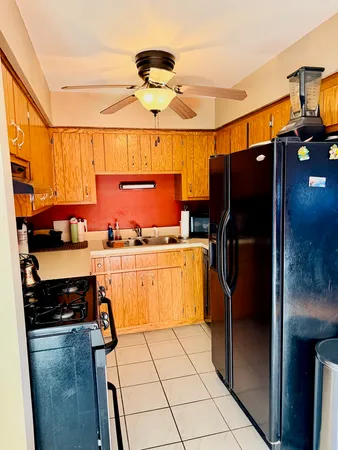 a bathroom with a sink a toilet and shower curtain