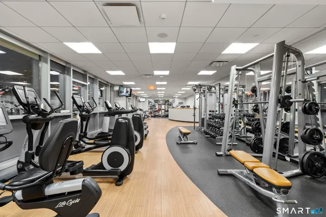 a kitchen with stainless steel appliances granite countertop a sink and a refrigerator