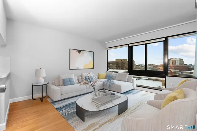 a living room with furniture and a large window