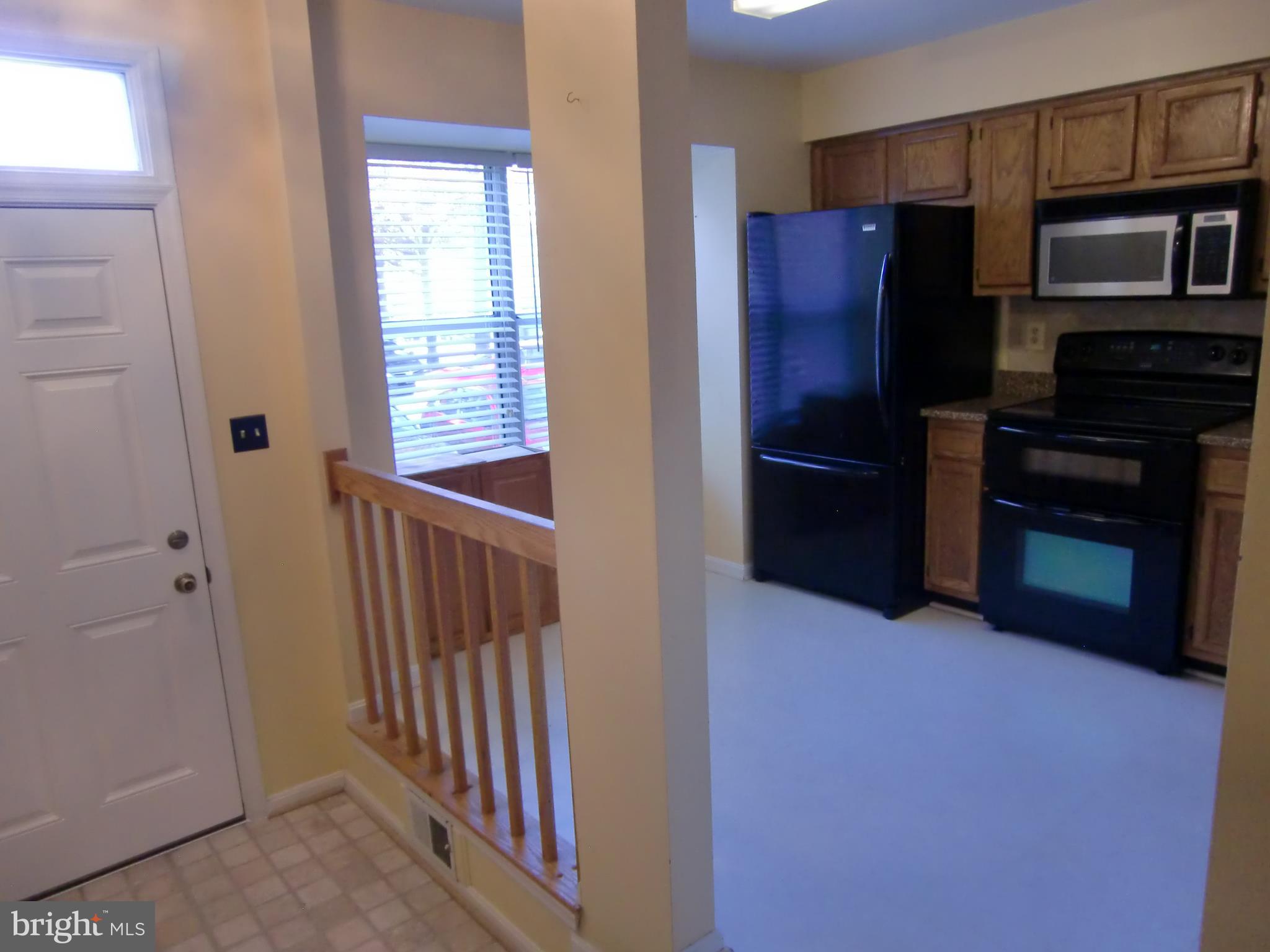 9545 Clocktower Lane Columbia, MD 21046 - Photo 3 of 25 Kitchen in front of home with lots of light and pa