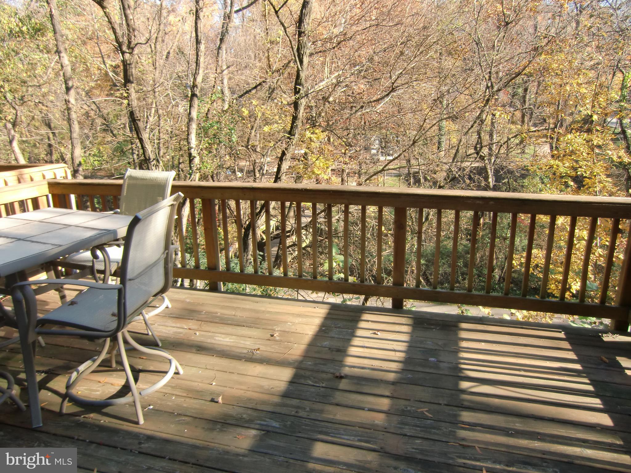 9545 Clocktower Lane Columbia, MD 21046 - Photo 8 of 25 huge deck to trees and open space and playground