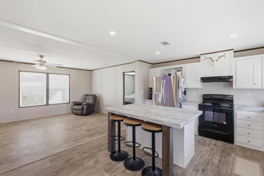 7553 Hutcheson Hill Road Springtown, TX 76082 - Photo 14 of 40 Kitchen to living