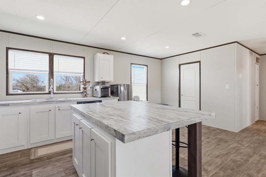 7553 Hutcheson Hill Road Springtown, TX 76082 - Photo 16 of 40 kitchen and dining