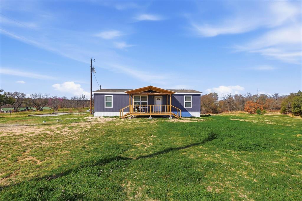 7553 Hutcheson Hill Road Springtown, TX 76082 - Photo 2 of 40 Front showing front lawn