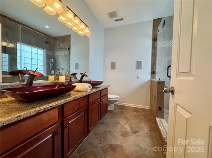 a bathroom with a shower and a toilet