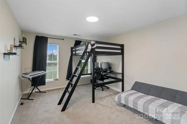 a view of an empty room with stairs