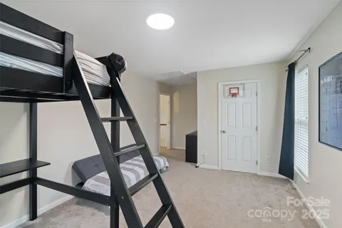 a bathroom with a double vanity sink mirror and toilet