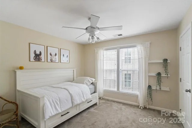 a view of a livingroom with a chandelier fan
