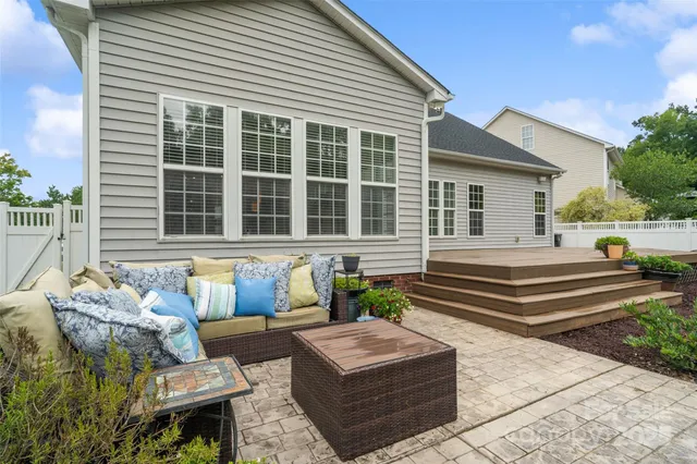 a view of a swimming pool and trees in the background