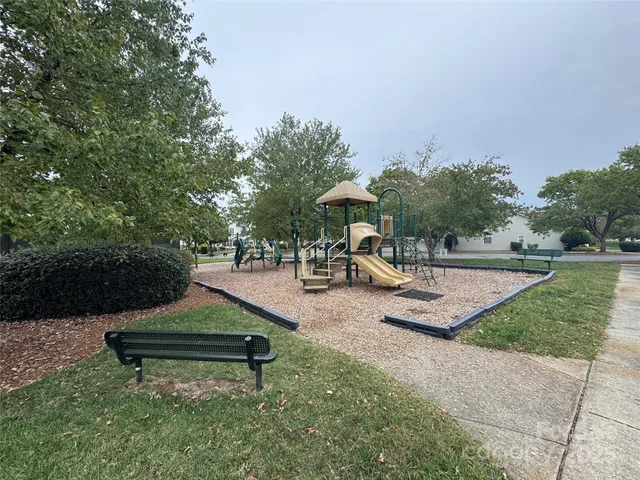 a view of a lake with houses in the background