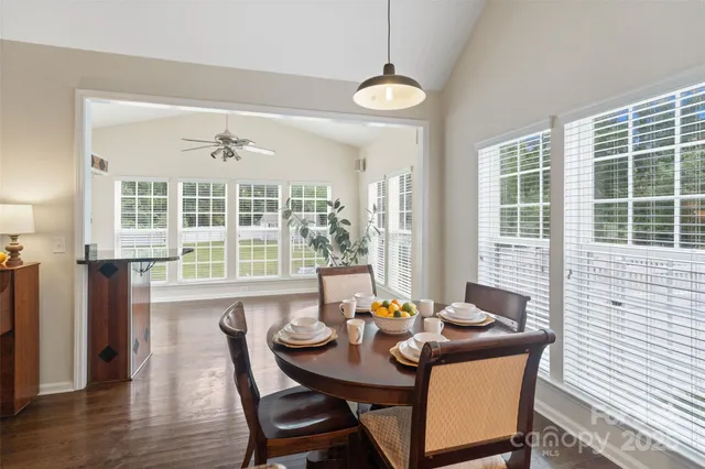 a view of a dining room with furniture window and wooden floor