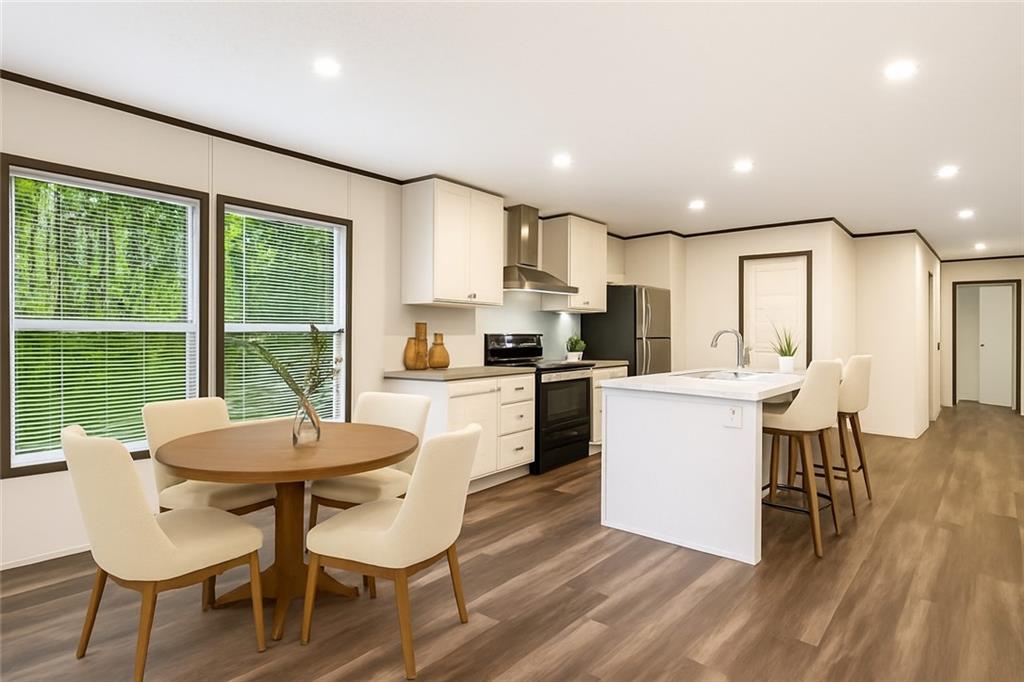 152 Wendy Hill Road Ellijay, GA 30536 - Photo 11 of 42 a kitchen with a dining table chairs and refrigerator