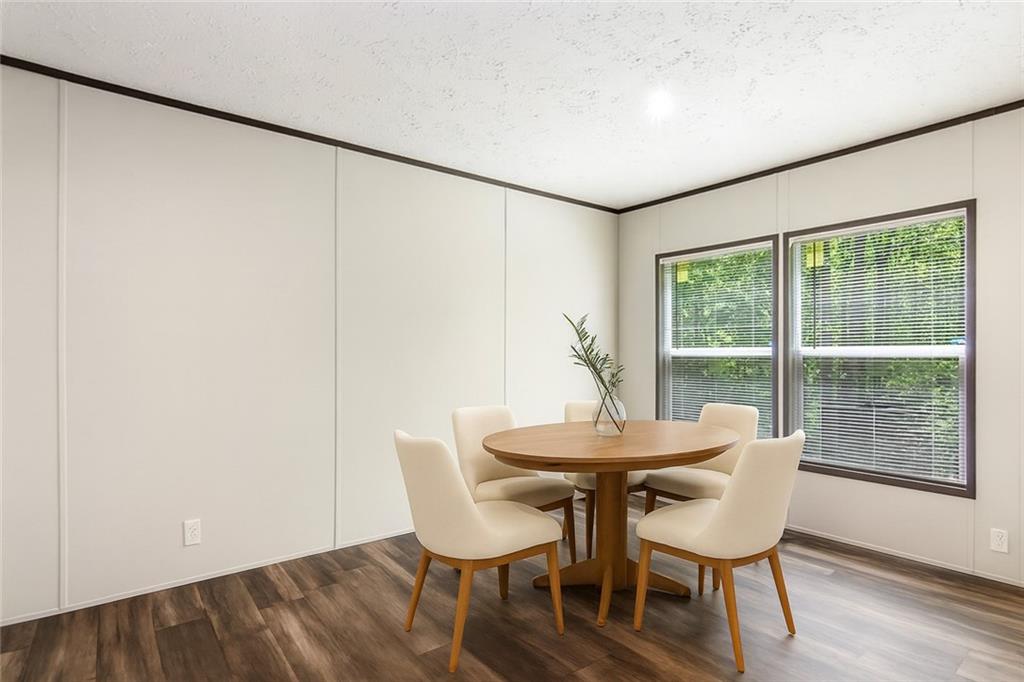 152 Wendy Hill Road Ellijay, GA 30536 - Photo 16 of 42 a dining room with furniture and wooden floor