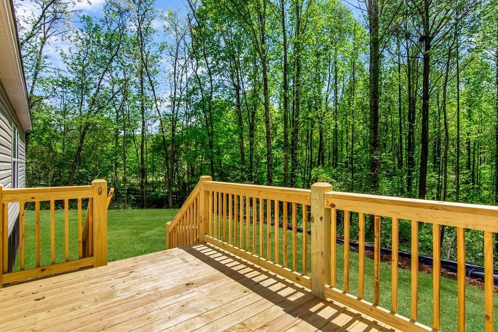 152 Wendy Hill Road Ellijay, GA 30536 - Photo 18 of 42 a view of a wooden deck and trees