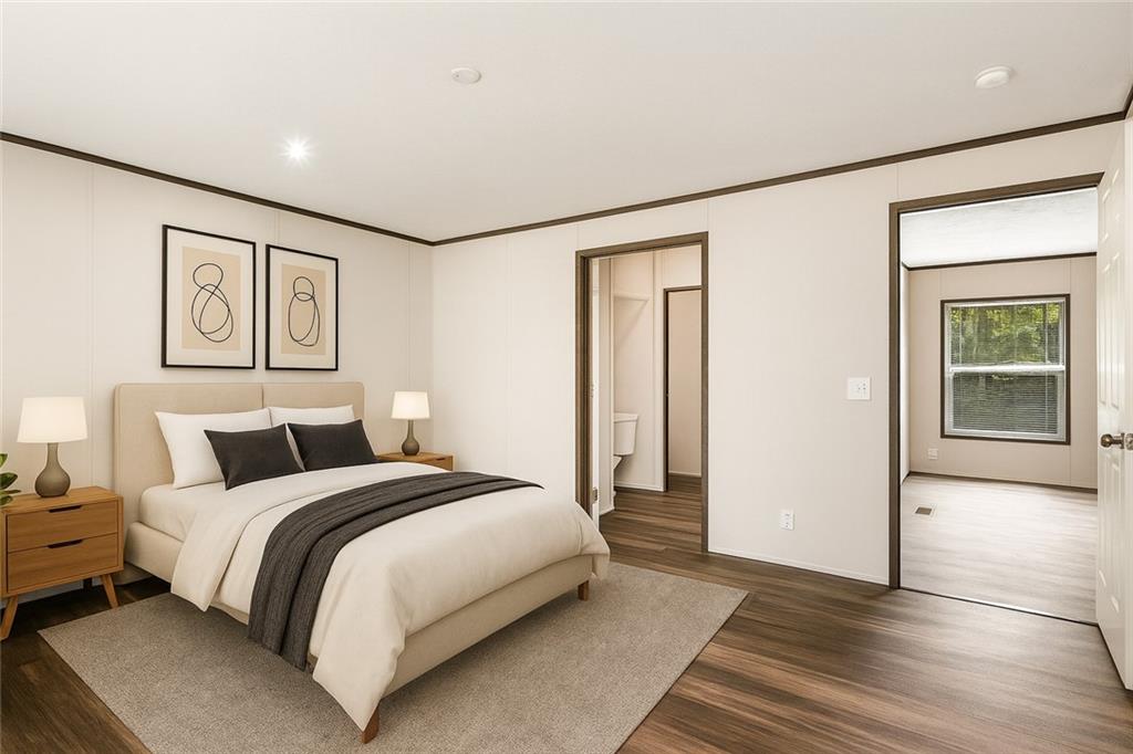 152 Wendy Hill Road Ellijay, GA 30536 - Photo 19 of 42 a bedroom with a large bed and a painting on the wall