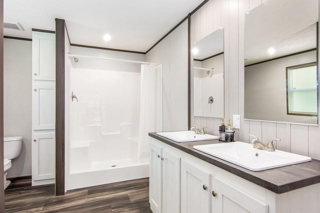 152 Wendy Hill Road Ellijay, GA 30536 - Photo 21 of 42 a bathroom with a sink a toilet and shower