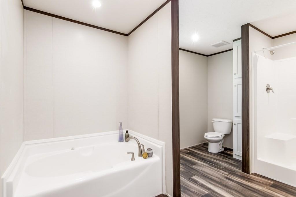 152 Wendy Hill Road Ellijay, GA 30536 - Photo 22 of 42 a bathroom with a bathtub and a toilet