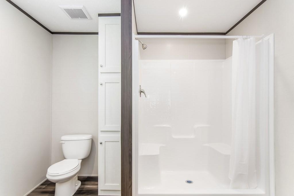 152 Wendy Hill Road Ellijay, GA 30536 - Photo 23 of 42 a bathroom with a toilet and a shower