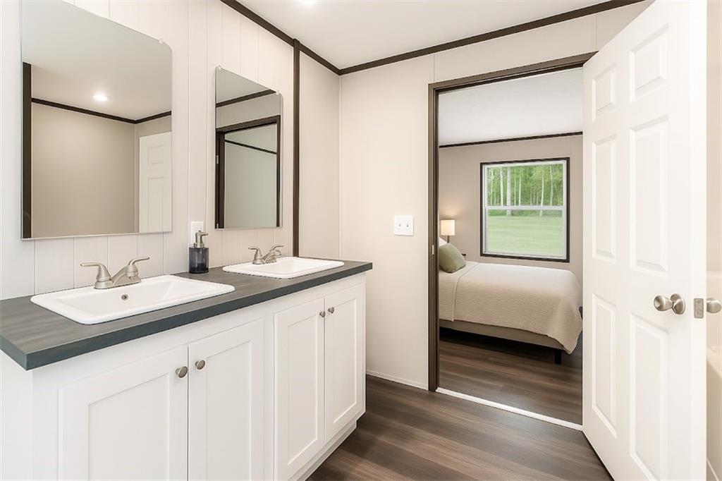 152 Wendy Hill Road Ellijay, GA 30536 - Photo 24 of 42 a en suite bathroom with a double vanity sink and a mirror