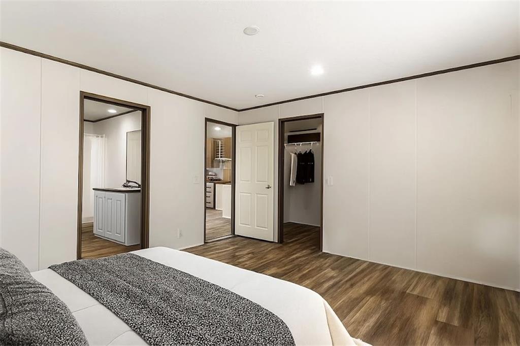 152 Wendy Hill Road Ellijay, GA 30536 - Photo 27 of 42 a bedroom with a bed and a mirror