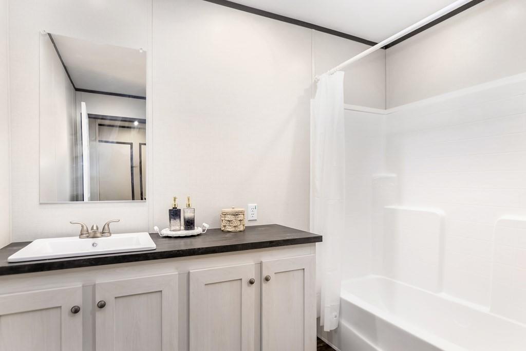 152 Wendy Hill Road Ellijay, GA 30536 - Photo 30 of 42 a bathroom with a sink and a mirror