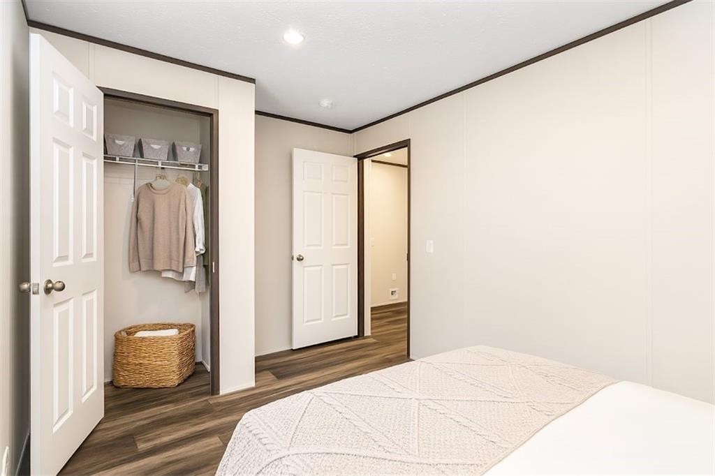 152 Wendy Hill Road Ellijay, GA 30536 - Photo 34 of 42 a bedroom with a bed and a mirror