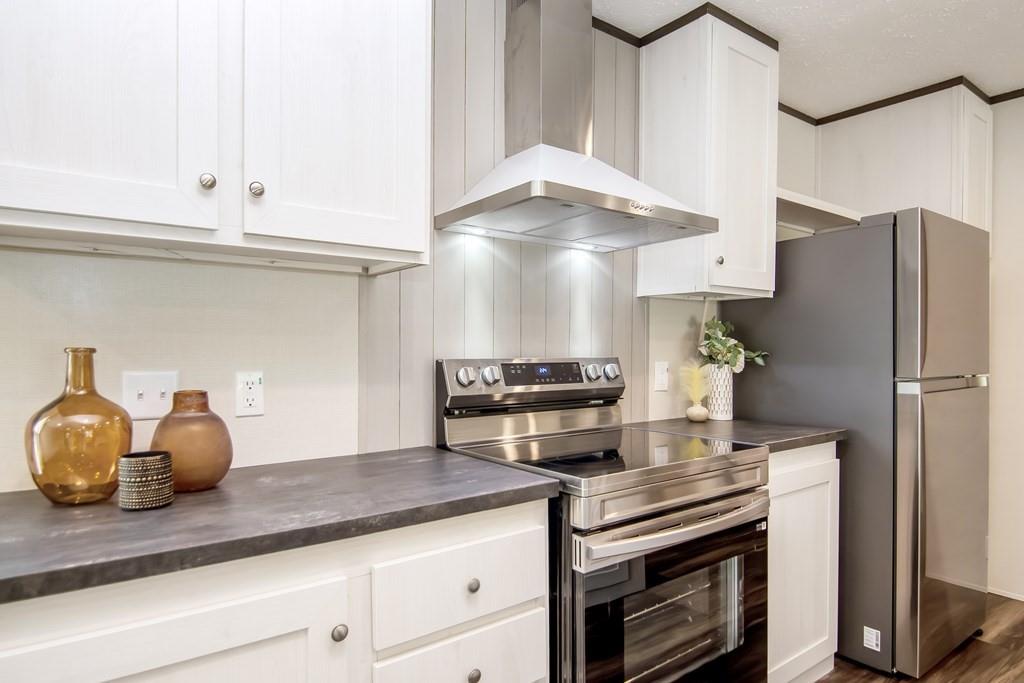 152 Wendy Hill Road Ellijay, GA 30536 - Photo 8 of 42 a kitchen with stainless steel appliances white cabinets and a stove