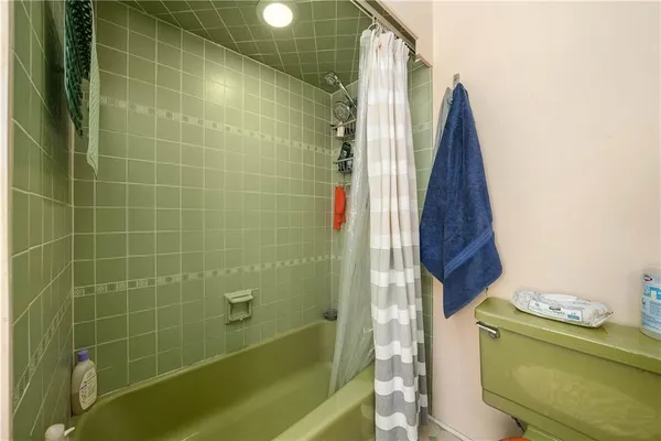a bathroom with a shower and a tub