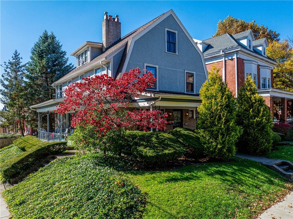 853 Collins Street Pittsburgh, PA 15206 - Photo 2 of 31 a front view of house and yard with beautiful flowers and green space
