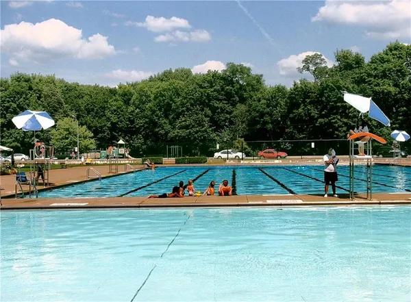 a view of outdoor space with playground and green space