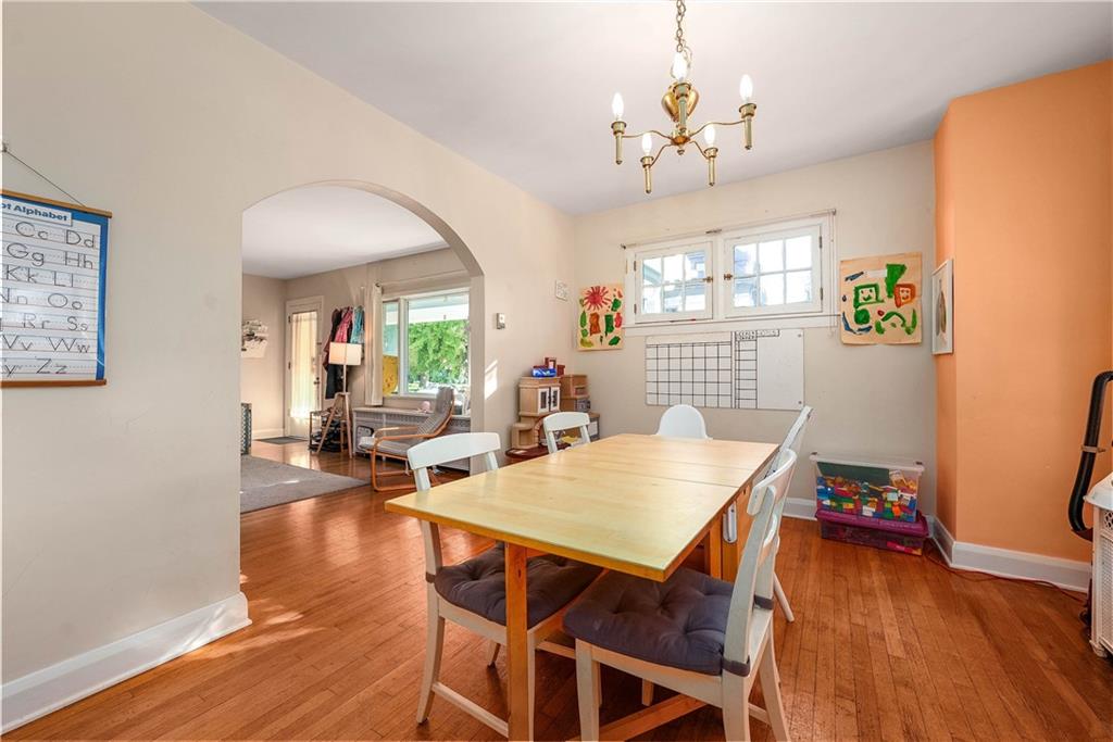 853 Collins Street Pittsburgh, PA 15206 - Photo 8 of 31 a view of a dining room with furniture wooden floor and chandelier